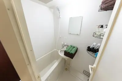 a bathroom with a toilet and a sink at Villa Boushu KURAMAE in Tokyo