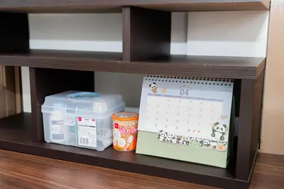 a shelf with a calendar and containers on it at \u938c\u5009\u56db\u4e01\u76ee in Tokyo