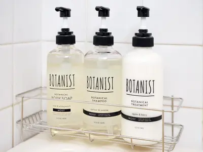 three bottles of soap sitting on a shelf in a bathroom at Tokyo Retreat -SUMIDA- in Tokyo