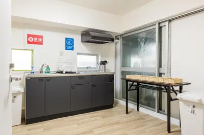 a kitchen with a counter and a table in it at Higashi-Shinjuku 1001 in Tokyo