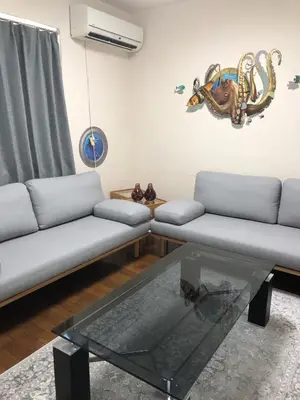 a living room with a couch and a glass table at \u65b0\u5bbf\u5f92\u6b69\u570f\u306e\u30db\u30c6\u30eb\u897f\u65b0\u5bbf\u4e94\u4e01\u76ee\u99c52\u5206 in Tokyo