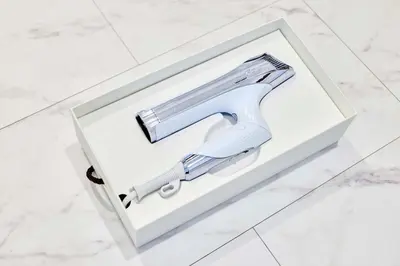 a hair dryer in a box on a bathroom floor at Villa Sumida Five in Tokyo