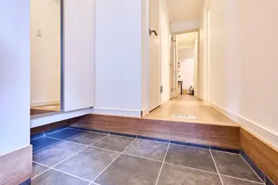 an empty hallway with a tile floor and white walls at Villa Sumida Five in Tokyo