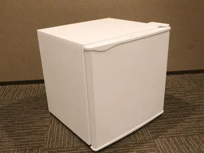 a white refrigerator sitting on top of a floor at Hotel LiVEMAX Shiodome in Tokyo