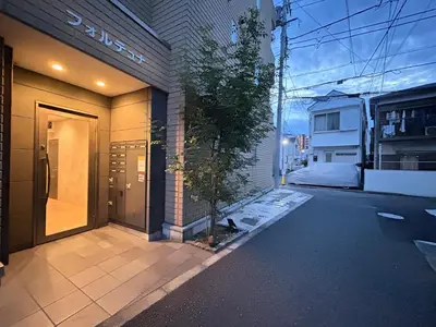 a door to a building with a tree next to it at itabashi-ku5 minutes to station 103 in Tokyo