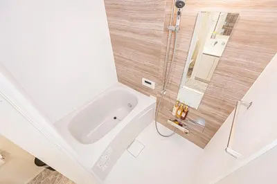 a bathroom with a tub and a sink at 67 Apartment Ueno in Tokyo