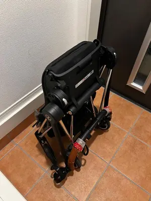 a black camera on a tripod on the floor at MEET IN SKYtree in Tokyo