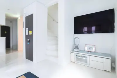 a living room with a flat screen tv on a wall at MEET IN SKYtree in Tokyo