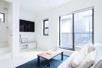 a white living room with a couch and a table at MEET IN SKYtree in Tokyo