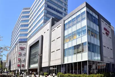 a large building with people walking in front of it at AMs house 5 min to Ikebukuro 13 min to Shinjuku Station 19 min to Shibuya Station in Tokyo