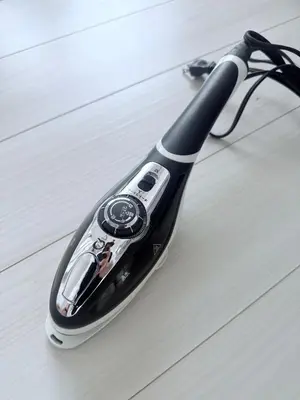 a black and white electric toothbrush sitting on the floor at Terrace Tokyo Otsuka North in Tokyo