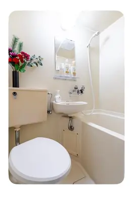 a bathroom with a toilet and a sink and a tub at Cozy Room near Shinjuku Shibuya Ikebukuro in Tokyo