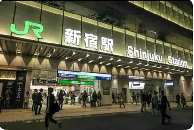 a group of people walking in front of a subway station at Cozy Room near Shinjuku Shibuya Ikebukuro in Tokyo