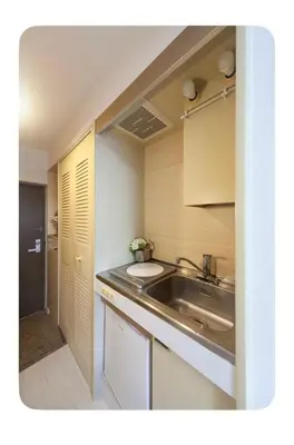 a small kitchen with a sink and a sink at Cozy Room near Shinjuku Shibuya Ikebukuro in Tokyo