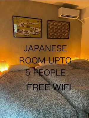 a room with a bed with a sign that reads japanese room upofi at Cozy Room near Shinjuku Shibuya Ikebukuro in Tokyo