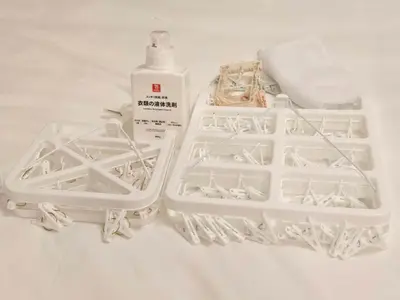 two white plastic containers with a bottle of bleach at MIKASA guesthouse2 in Tokyo