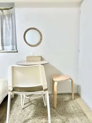 a chair and a table and a mirror in a room at MIKASA guesthouse2 in Tokyo