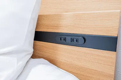 a close up of a bed frame with a clock on it at \u30bf\u30b9\u30ad\u30b9\u30de\u30fc\u30c8\u6c60\u888b\u4e00\u53f7\u9928Tasuki Smart Ikebukuro1 in Tokyo