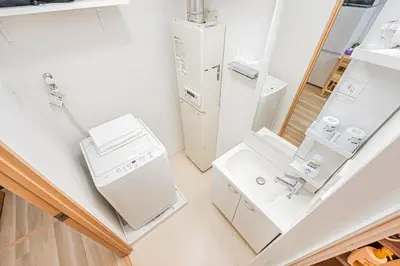 a kitchen with white appliances and a sink at \u30bf\u30b9\u30ad\u30b9\u30de\u30fc\u30c8\u6c60\u888b\u4e00\u53f7\u9928Tasuki Smart Ikebukuro1 in Tokyo