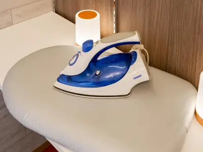 a blue and white telephone sitting on a table at Ikebukuro-Shinjuku-5min Zoshigaya Sta-Easy train access to Shinjuku and Shibuya in Tokyo