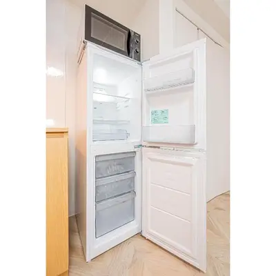 a refrigerator with its door open in a kitchen at Japan House Edogawabashi Retaw Hills Aprtment in Tokyo
