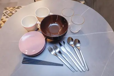 a white table with silverware on top of a table at Flat K Plum Umegaoka by Tranova in Tokyo
