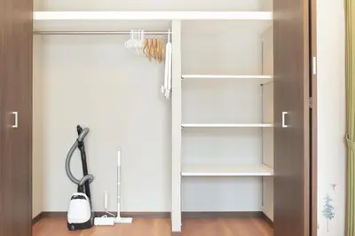 a walk in closet with white shelves at Cure Azumabashi by Tranova in Tokyo