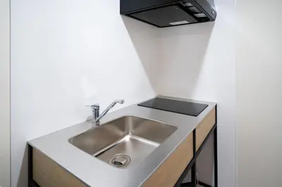 a kitchen with a sink and a counter top at Yamamoto building by Tranova in Tokyo