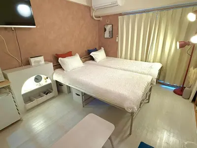 a hospital room with two beds and a table at Omori 8min Stylish and comfortable room in Tokyo