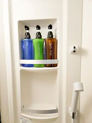 a cabinet with three bottles of water in it at \u4e2d\u91ce\u30b7\u30a8\u30b9\u30bf\u30d7\u30ea\u30e0\u30e9 in Tokyo