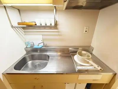 a kitchen counter with a sink and a bowl at The Vera in Tokyo