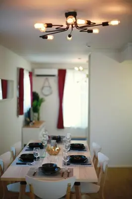 a dining room table with wine glasses on it at SCD155 Spacious Villa in Ikebukuro Suburbs Direct Access to Tokyo's Core Commercial Districts in Tokyo
