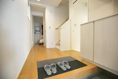 a group of three pairs of shoes on a rug in a room at SCD155 Spacious Villa in Ikebukuro Suburbs Direct Access to Tokyo's Core Commercial Districts in Tokyo