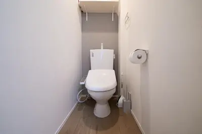 a bathroom with a white toilet in a room at PRIME Asakusa by Tranova in Tokyo