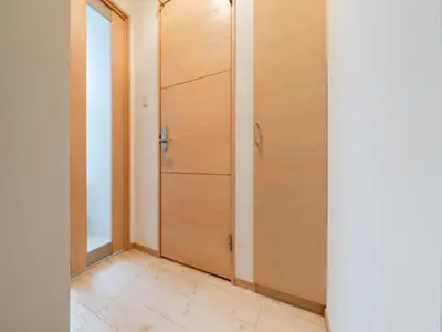 a hallway with wooden doors and a wooden floor at Ikebukuro 10 min-Family-Friendly Stay-Mobile Wi-Fi&Switch-Net in Tokyo