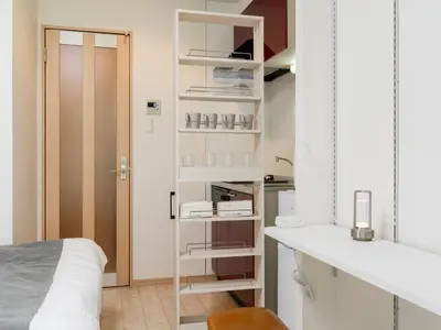 a white room with a bed and a desk at Ikebukuro 10 min-Family-Friendly Stay-Mobile Wi-Fi&Switch-Net in Tokyo