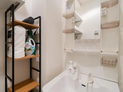 a bathroom with a sink and a mirror at Ikebukuro 10 min-Family-Friendly Stay-Mobile Wi-Fi&Switch-Net in Tokyo