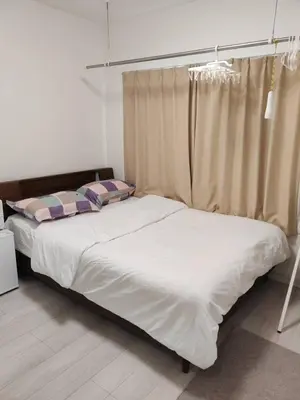 a bedroom with a large bed with a curtain at \u6771\u4eac\u5929\u7a7a\u4e4b\u5bb6\u65c5\u9986101\u72ec\u7acb\u516c\u5bd3 \u72ec\u7acb\u536b\u6d74 in Tokyo