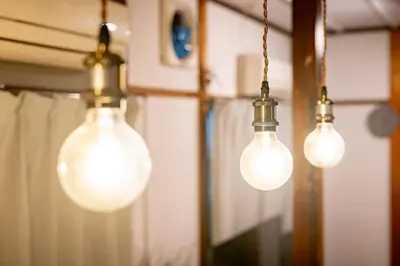 a group of three lights hanging from a wall at \u4e2d\u677f\u6a4b in Tokyo