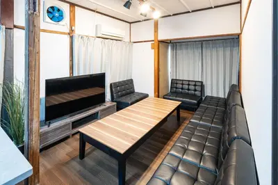 a living room with a couch and a table and a tv at \u4e2d\u677f\u6a4b in Tokyo