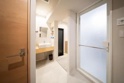 a bathroom with a door leading to a sink at Humming Kinshicho 303-202-301 - Vacation STAY 18969 in Tokyo