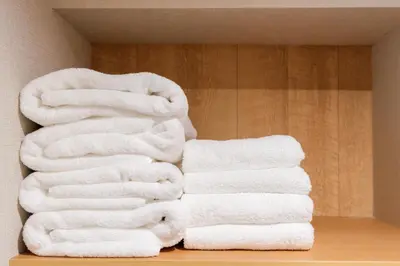 a pile of towels are stacked in a bathroom at Humming Kinshicho 303-202-301 - Vacation STAY 18969 in Tokyo