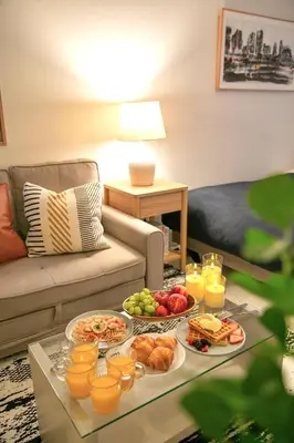 a living room with a tray of food on a table at Generous Forest 101 in Tokyo