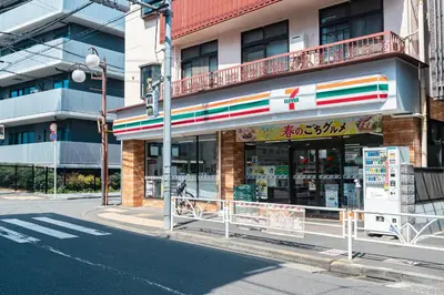 a store on the side of a city street at untio residence HATAGAYA North in Tokyo