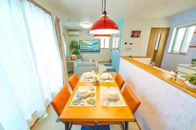 a dining room with a table and chairs in a room at Sumida A Cozy Entire House Sleeps 8 Near Station Tokyo Skytree Asakusa in Tokyo