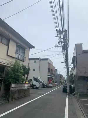 an empty street in a city with a building at Li Tokyo otta in Tokyo