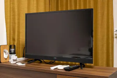 a large flat screen tv sitting on a table at Livecore -Apartment hotel- in Tokyo