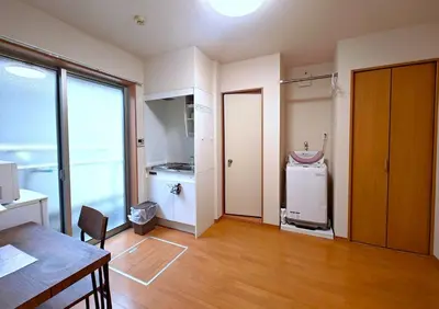 an empty room with a kitchen and a refrigerator at Senju 101, Cozy Tokyo Studio in Tokyo