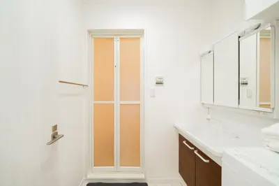 a bathroom with a shower and a sink at Nine Lane Nippori in Tokyo