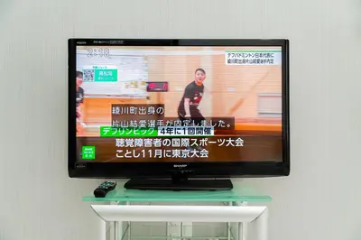 a flat screen tv sitting on top of a table at Nine Lane Nippori in Tokyo